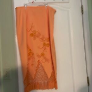 Very pretty fancy orange skirt.